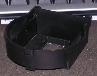 The feeder housing showing part of the cutout and the factory provided modification marks