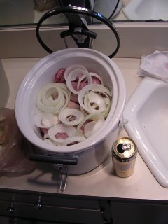 Three kinds of brats, Johnsonville Stadium, Turkey, and local Deli, and a large onion in my new crockpot