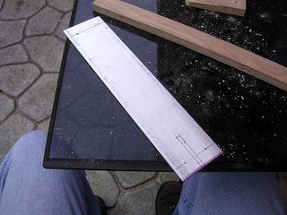 Aluminum bar stock marked and ready for drilling