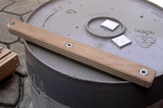 wooden brace with nuts recessed into the side