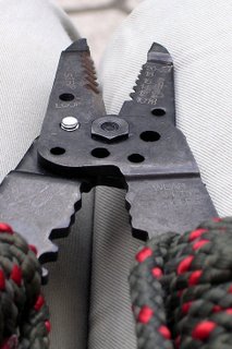 Wire cutter cutting a bolt.