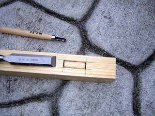 Starting to cut the mortise wood joint with a chisel