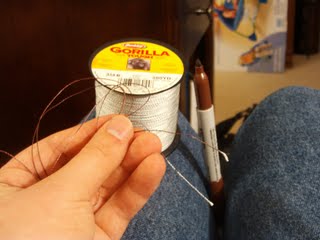 The fishing lined used to sew the journal together