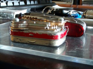 Keys bolted to an Altoids tin as a keychain