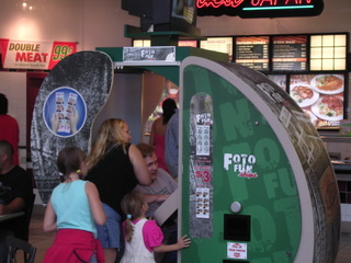Brother Todd, Sister Angela, Neices Kayla and Brianna futzing with a photo booth after lunch at the mall.