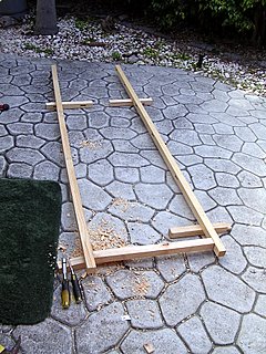 assembling the first cross member to the 2 uprights